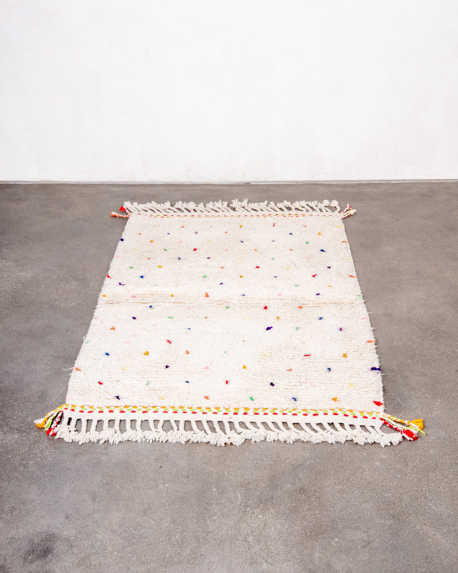 Modern, designer, handcrafted Berber rug from Morocco. Beniourain carpet with beautiful colours and patterns and fluffy wool texture.